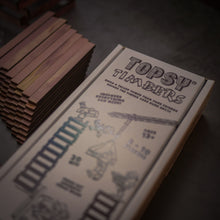Load image into Gallery viewer, Topsy Timbers - The Incredibly Entertaining, Addictive, & Competitive Tower Building Game Designed & Manufactured from Aromatic Cedar in Our Los Angeles Workshop. Fun for the whole family with elements of chance and sabotauge! The boss went home early leaving you and the crew to manage the timberyard. Grab the keys to the crane, it's time to have some fun... Build a taller tower than your friends before the timberyard runs dry!