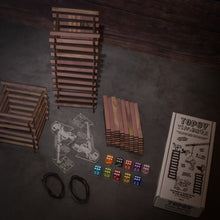 Load image into Gallery viewer, Topsy Timbers - The Incredibly Entertaining, Addictive, & Competitive Tower Building Game Designed & Manufactured from Aromatic Cedar in Our Los Angeles Workshop. Fun for the whole family with elements of chance and sabotauge! The boss went home early leaving you and the crew to manage the timberyard. Grab the keys to the crane, it's time to have some fun... Build a taller tower than your friends before the timberyard runs dry!